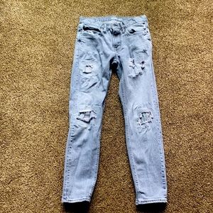 Distressed denim jeans